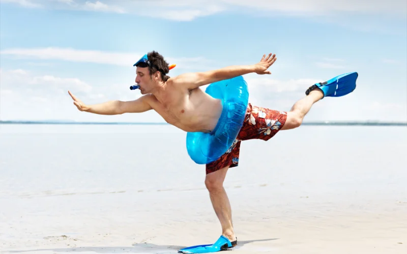 a man posing at a beach